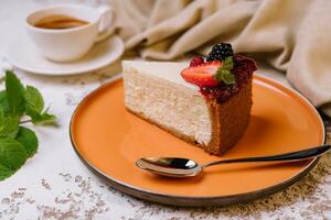 Piece of cheesecake and coffee cup photo