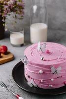 pink cake decoration in the form of butterflies photo