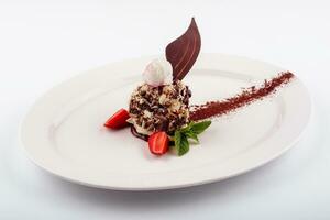 chocolate dessert with ice cream and strawberries photo