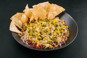 Mexican corn salsa in white bowl photo