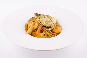 Italian Pasta with seafood isolated on white photo