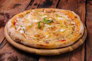 Shrimp pizza with different types of cheese photo