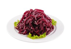 Fresh grated beetroot salad on plate photo