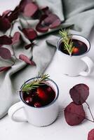 mulled wine in a vintage white mugs photo