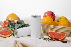 soda in a tin with oranges, grapefruits and pomegranate photo