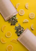 Paper bag with dry loose leaf tea with lemon slices photo