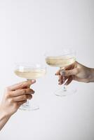 Cheers. Prosecco or white wine in beautiful glasses photo