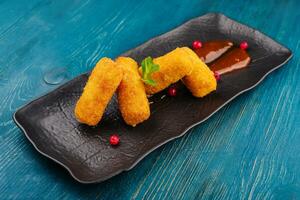 Breaded chicken strips with tomato ketchup photo