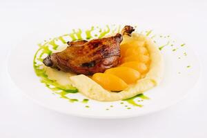 duck leg confit with mashed potatoes photo