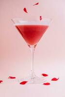 Strawberry alcohol cocktail in martini glass photo