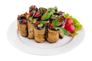 Rolls of fried eggplant stuffed with mayonnaise and tomatoes photo