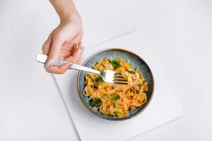 Italian spaghetti on fork close up photo