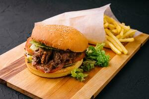 Pulled pork burger with french fries photo