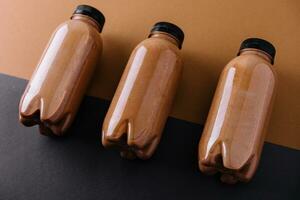 chocolate smoothies in plastic bottles photo