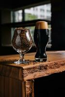 tasty dark beer and glass of wheat on wooden photo