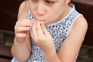 girl eating ice cream in the park photo