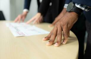 Close up of business people having a meeting in office. Business people working together concept photo