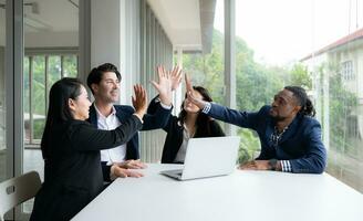 Group of business people having a meeting in the office. Business people working together in the office. photo