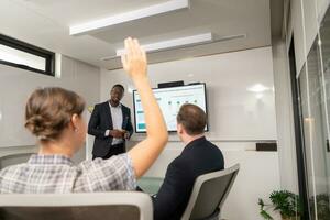 Businessman giving presentation to colleagues in conference room, Multiethnic group of businesspeople having meeting in modern office. photo