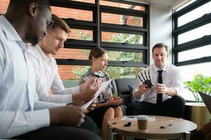 Group of diverse business people working together in the office, Brainstorming about the hand robot model to be used for production work photo