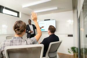 Businessman giving presentation to colleagues in conference room, Multiethnic group of businesspeople having meeting in modern office. photo