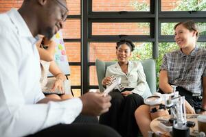 Group of diverse business people working together in the office, Brainstorming about the hand robot model to be used for production work photo