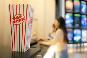 Cinema concept. People watching movie at cinema eating popcorn photo