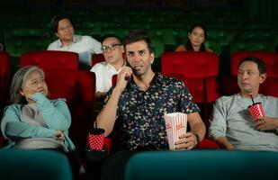 Movie etiquette, Do not talk on the phone while in the cinema, Group recreation and entertainment concept. photo