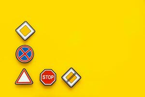road signs on yellow background with copy space photo