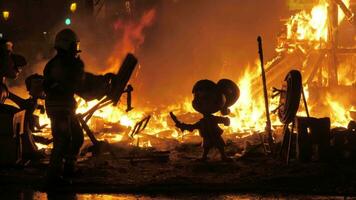 Firefighter burning ninots in the fire of La Cream on Fallas celebration, Spain video