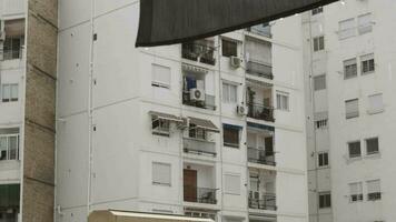 Apartment block view on dull rainy day video