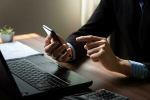 Businessman using mobile phone to open application, reading news, chatting or shopping online, searching information in internet, holding smartphone, internet business, digital marketing photo