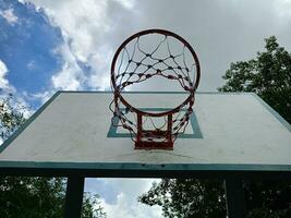 Hoops and hoop net, basketball court in Bangkok park, Thailand photo