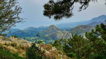 Perfect autumn landscape of the Asturian mountains seen from one of the highest viewpoints in the region photo