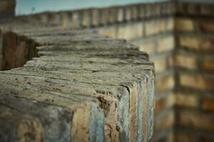 Brick well and corner with a nice bokeh. Rustic charm and blurred elegance photo