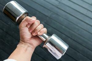 Hand holding  dumbbell photo