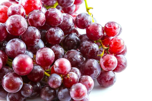 Red grape on white background