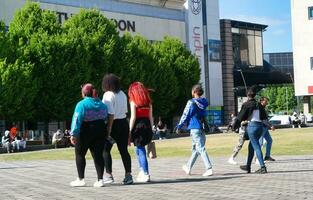 People are Walking at Main Shopping Center of Downtown City Centre of Luton City, England Great Britain UK. Image Captured on June 2nd, 2023 photo