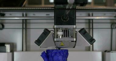 Creating object from blue plastic with 3D printer video