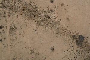 Weathered rusty sand wall background, grungy wall surface, aged sand wall texture photo