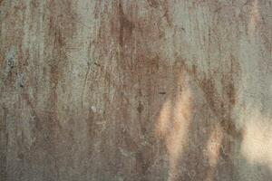 weathered sand wall surface backdrop, grungy cement wall background, aged dirty wall surface photo