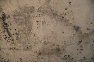 Weathered rusty sand wall background, grungy wall surface, aged sand wall texture photo