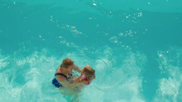 Mother teaching daughter to swim video