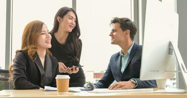 Startup young business people group working in modern office together. small group discussing something photo