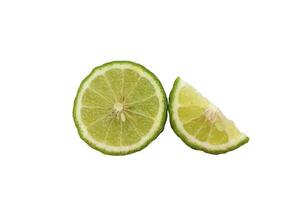 a lime and a slice of lime are cut in half photo