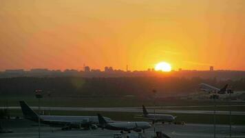 Airport view at golden sunset with an airplane taking off video