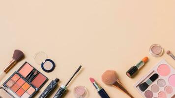 makeup products arranged on a beige background photo
