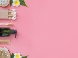 Directly above view of spa products on pink background, Healthcare spa concept with copy space photo