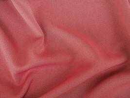 Fabric texture of natural cotton, wool, silk or linen textile material. Rose gold fabric background photo