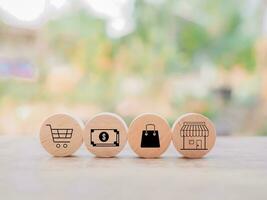 Wooden block with online shopping and e-commerce icons set. photo